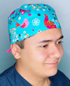 Colorful Birds & Butterflies on Turquoise Unisex Animal Scrub Cap