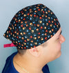 Neutral Toned Paws on Black Unisex Animal Scrub Cap
