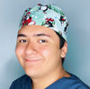 Cute Penguins in Snow Christmas/Winter themed Unisex Holiday Scrub Cap