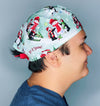 Cute Penguins in Snow Christmas/Winter themed Unisex Holiday Scrub Cap
