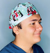 Cute Penguins in Snow Christmas/Winter themed Unisex Holiday Scrub Cap