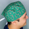 Candy Canes on Green Christmas/Winter themed Unisex Holiday Scrub Cap