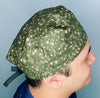 Dinosaurs Foot Prints on Hunter Green Unisex Animal Scrub Cap